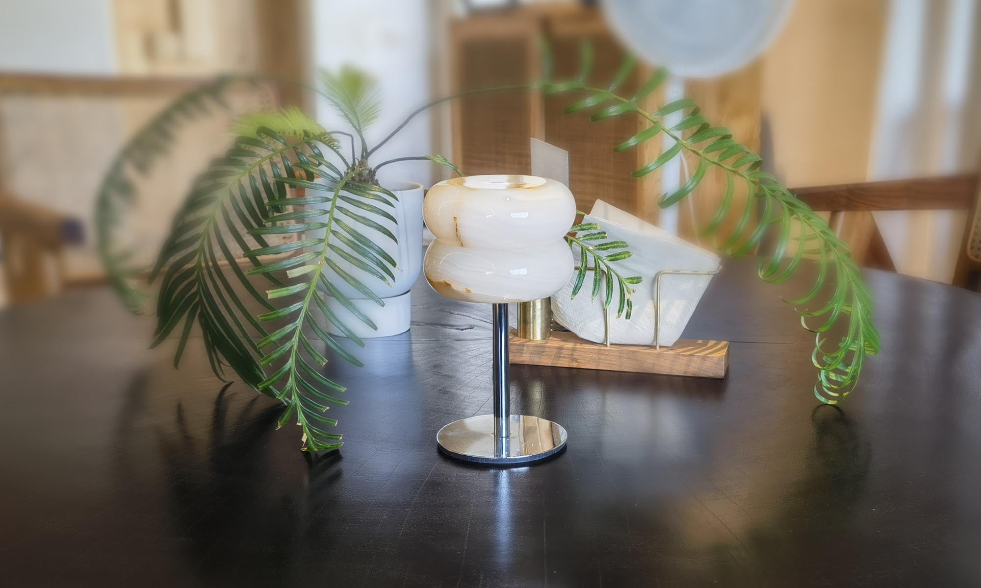 Onyx and natural stone lamp glowing softly in a refined modern interior