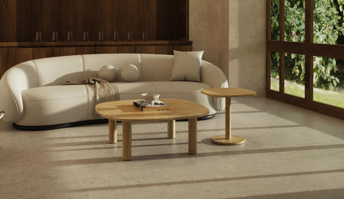 Square and soft square marble and travertine tables styled in a refined modern living room