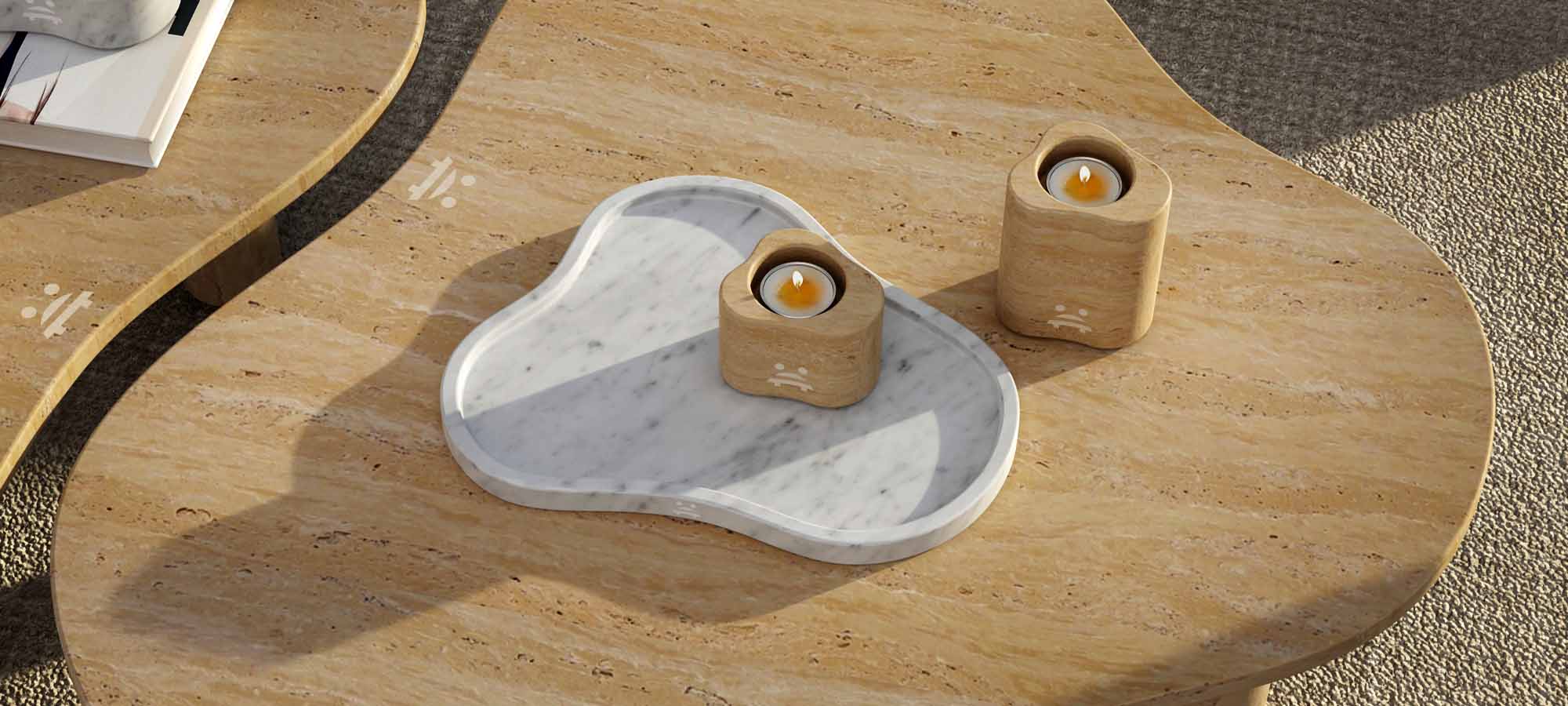 Decorative marble and travertine tray styled on a refined natural stone table