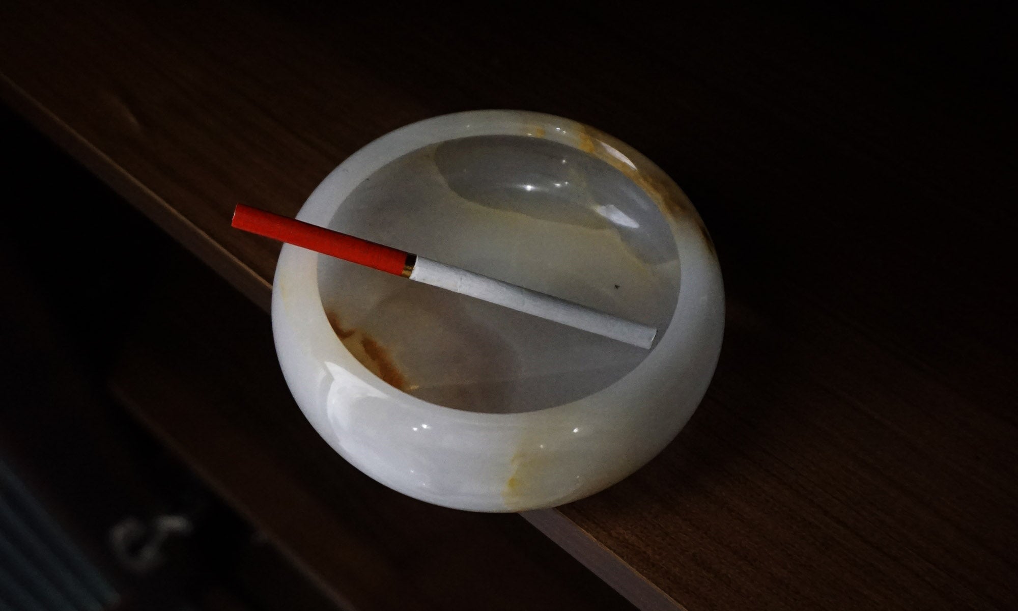 Marble and onyx ashtray styled on a refined modern table