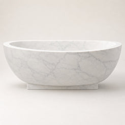 Aurelia Ivory Cloud Marble pedestal soaking bathtub, clean studio styled visualization