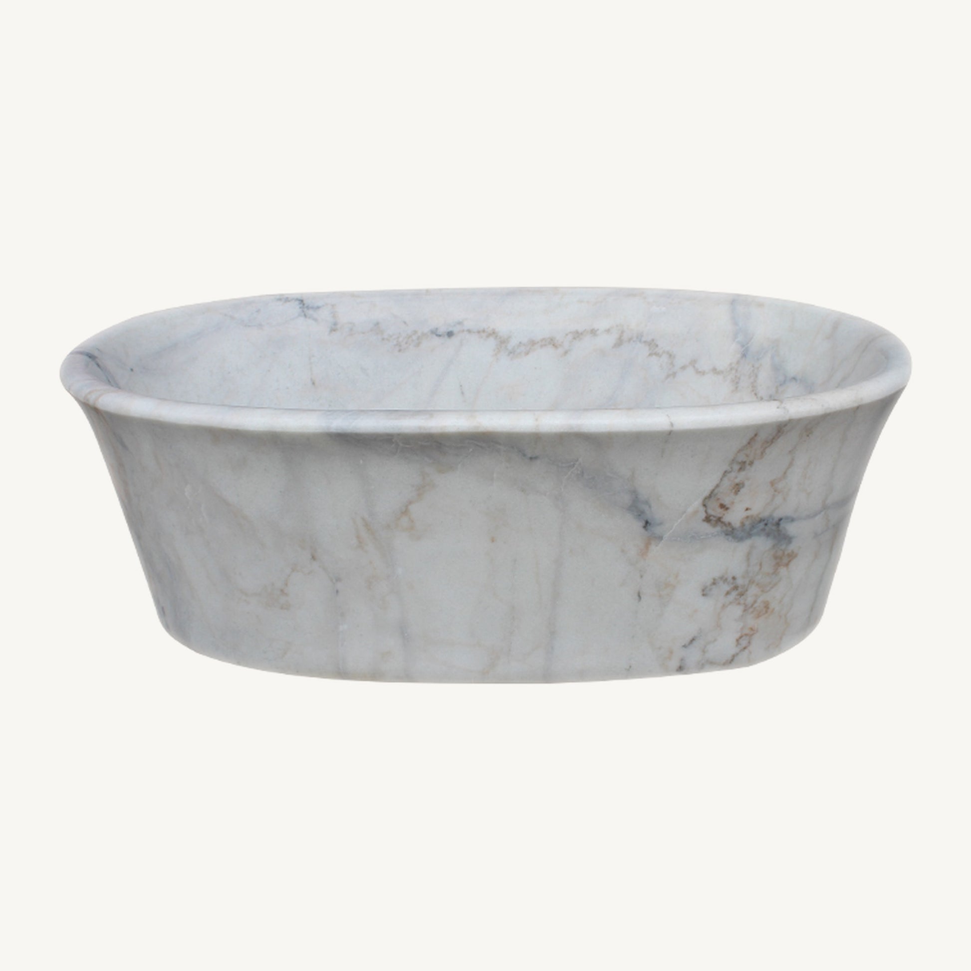 Elara freestanding Ivory Cloud Marble soaking bathtub with a thin rolled rim, front studio view