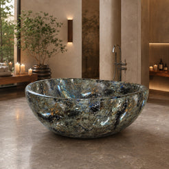 Lunara Celestia Blue Quartzite round freestanding soaking bathtub in a warm luxury spa bathroom, hero scene