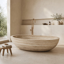 YOYO Cream Travertine freestanding soaking bathtub in a warm minimalist bathroom, styled visualization