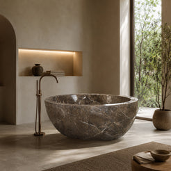 Aveline Dark Emperador Marble freestanding soaking bathtub in a serene architectural bathroom, second lifestyle scene