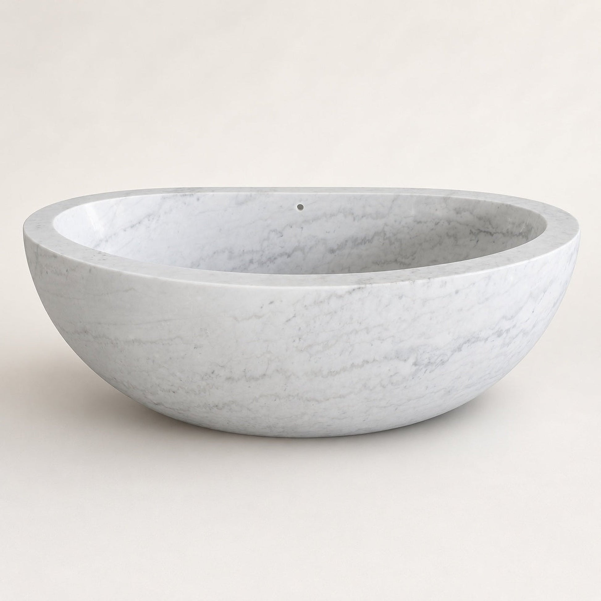 Avela Ivory Cloud Marble deep oval freestanding bathtub, clean studio view