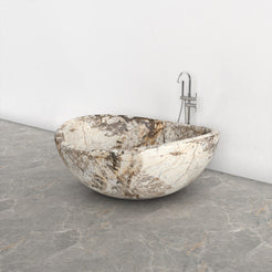 Lunara round freestanding Pandora Blanc Quartzite soaking bathtub, studio three-quarter view