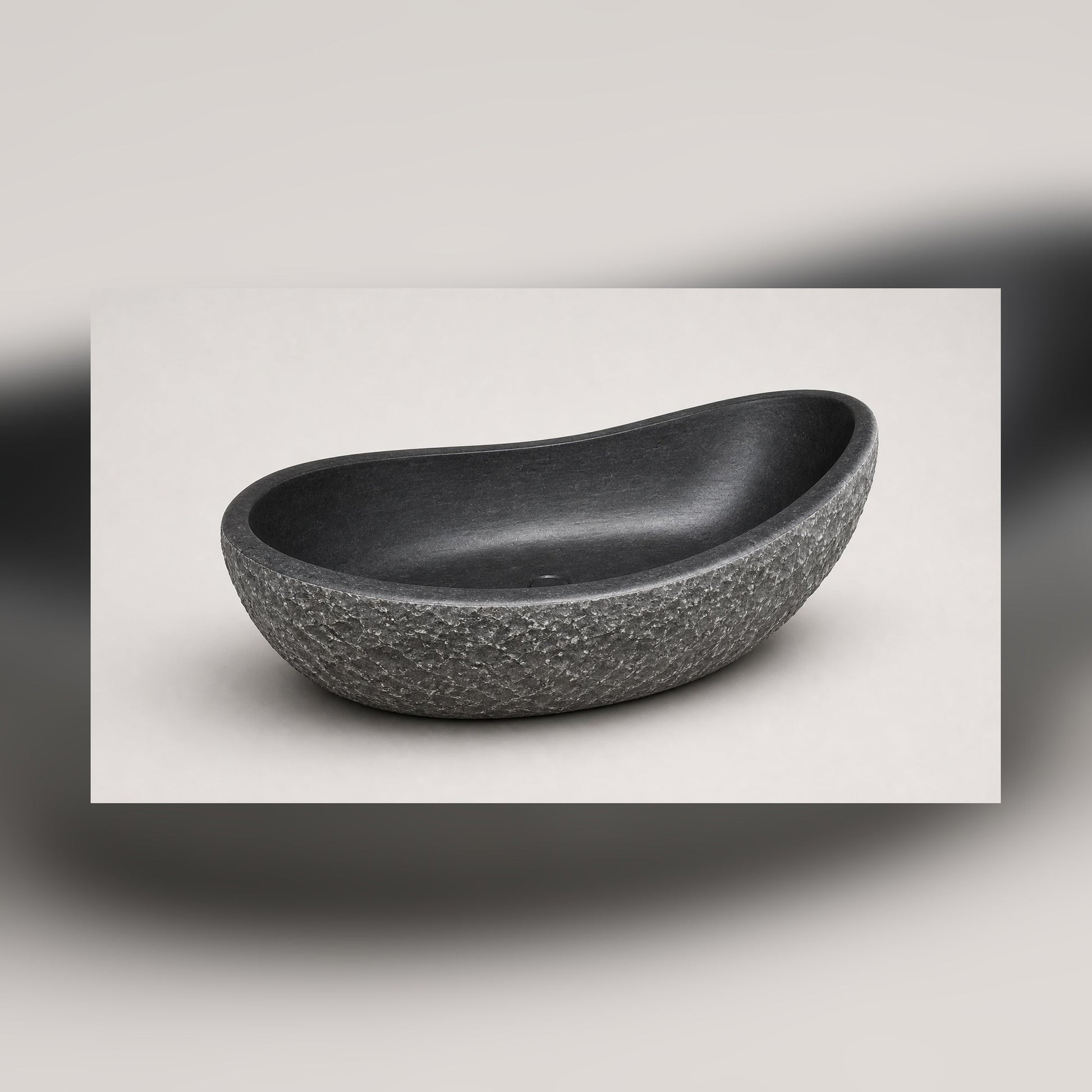 Noira Natural Black Granite freestanding bathtub, three-quarter studio visualization