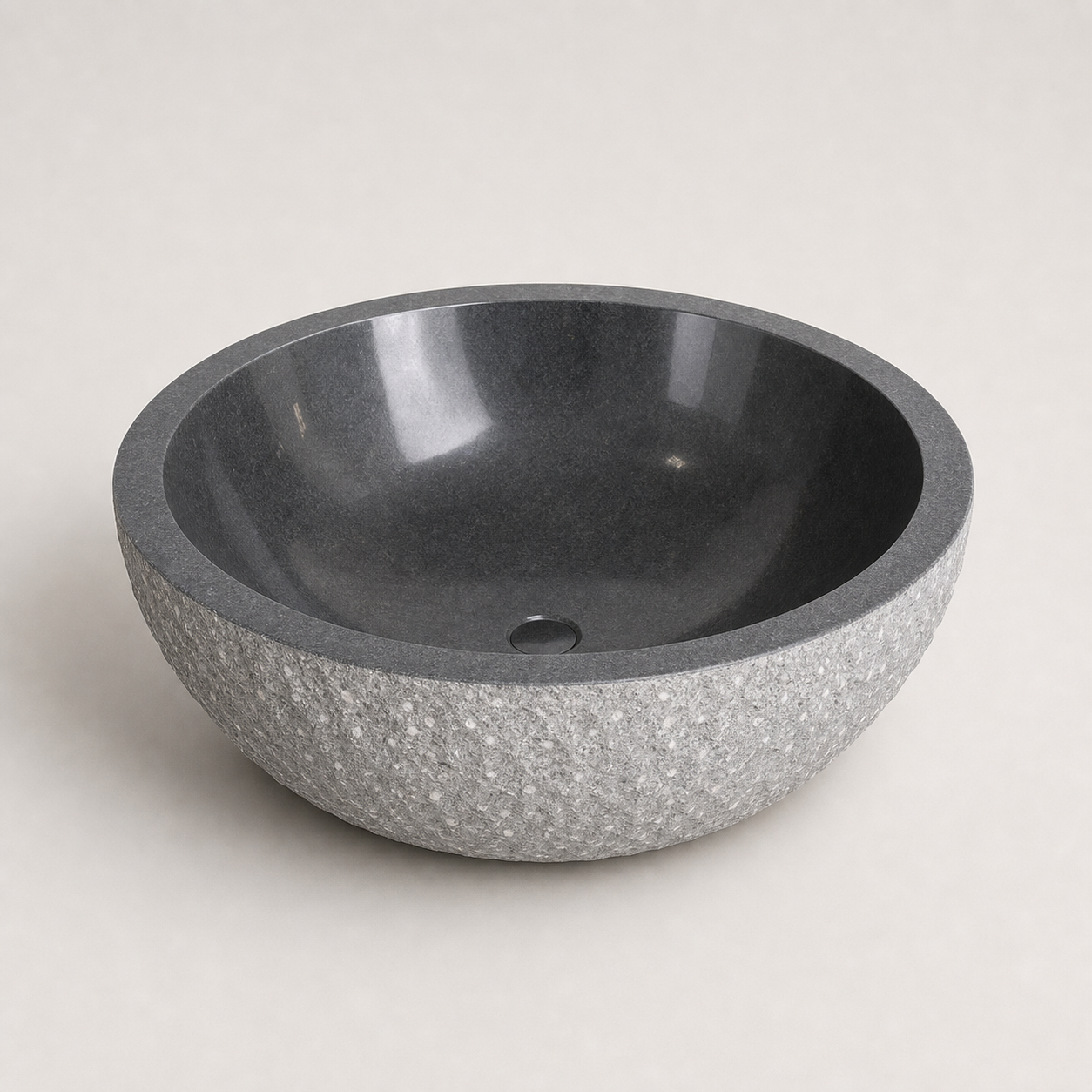 Oria round G654 Gray Granite bathtub with textured exterior, premium studio visualization