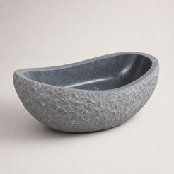 Veyra sculptural Charcoal Mist Granite freestanding bathtub, premium three-quarter studio view