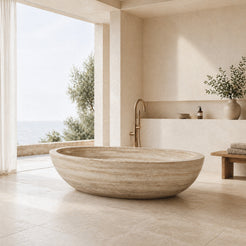 YOYO Cream Travertine soaking bathtub in a bright coastal luxury bathroom, styled visualization