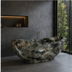 Yuna Celestia Blue Quartzite soaking bathtub in a dark stone modern architectural bathroom, styled visualization