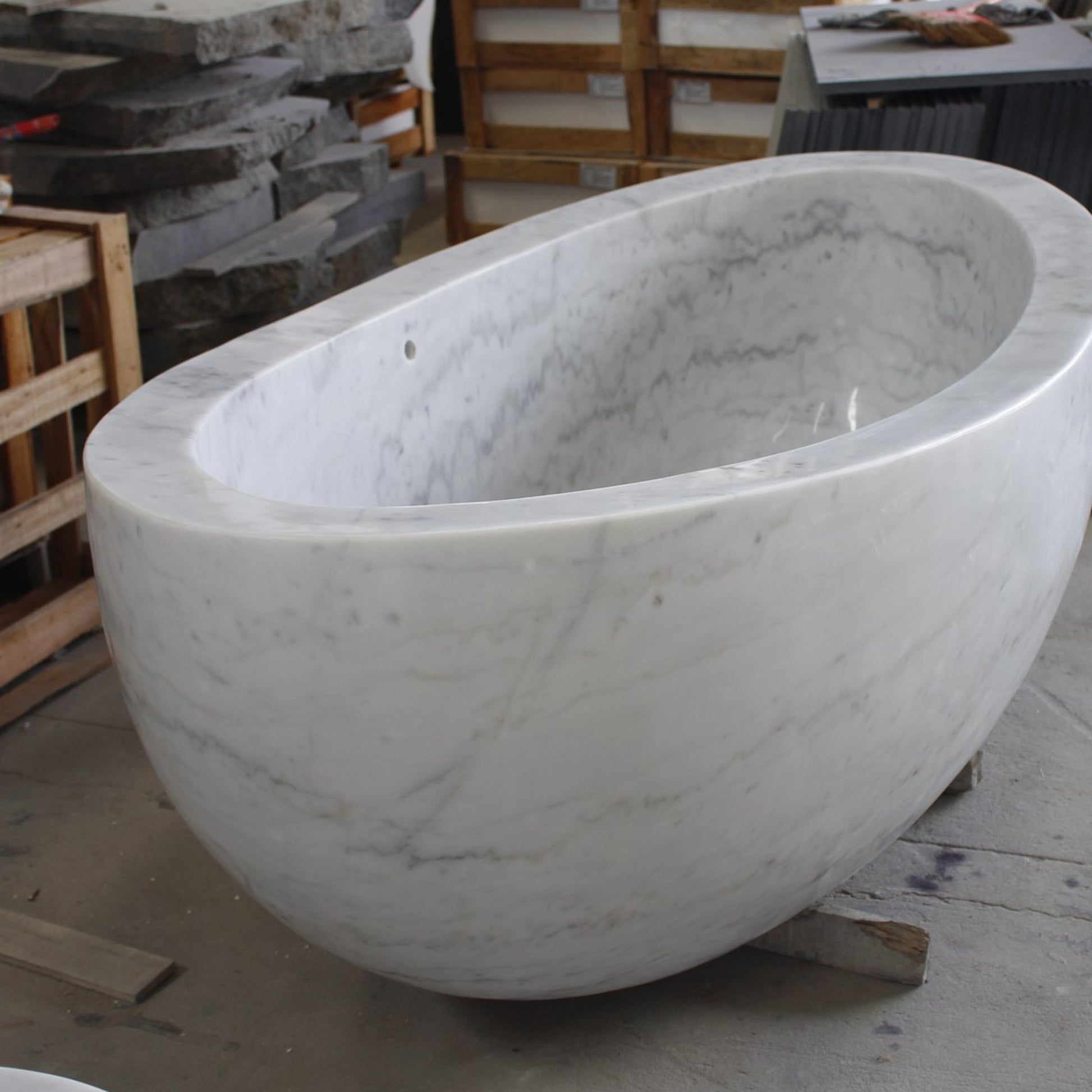 Avela BT-112A Ivory Cloud Marble bathtub, real three-quarter workshop view