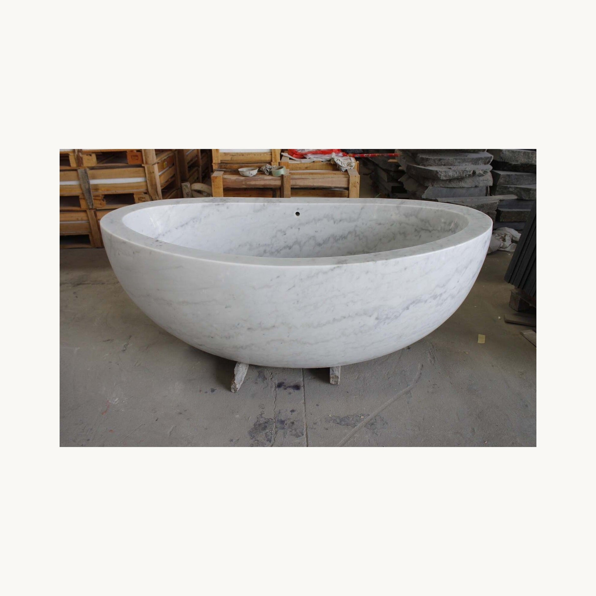 Avela BT-112A Ivory Cloud Marble bathtub, real three-quarter workshop view