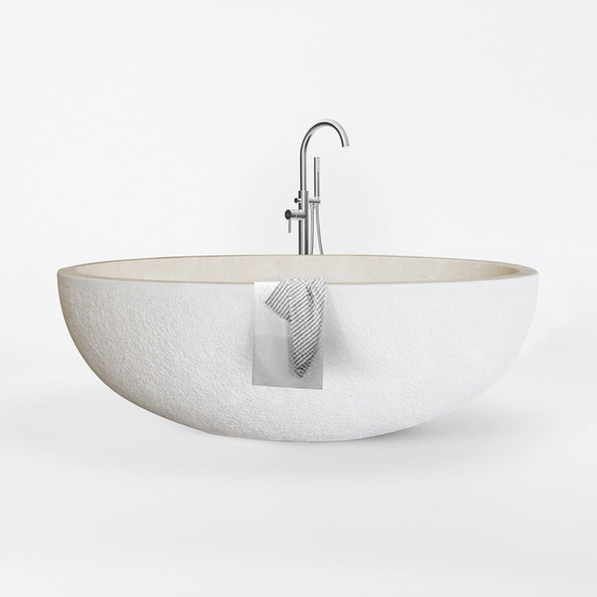 Evania Crema Marfil Extra Marble bathtub with hand-chiseled exterior, studio front-view visualization