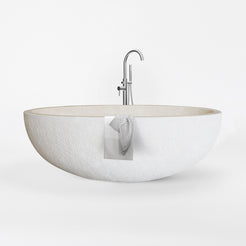 Evania Crema Marfil Extra Marble bathtub with hand-chiseled exterior, studio front-view visualization