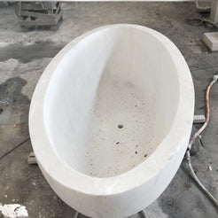 Actual Mira BT-031A Ivory Cloud Marble bathtub, real top and interior workshop view with centered drain