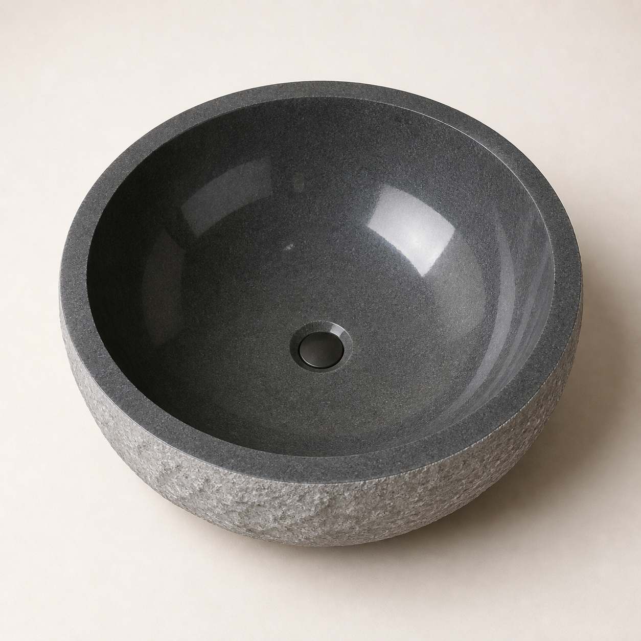 Oria G654 Gray Granite round bathtub, overhead view of the polished interior and center drain