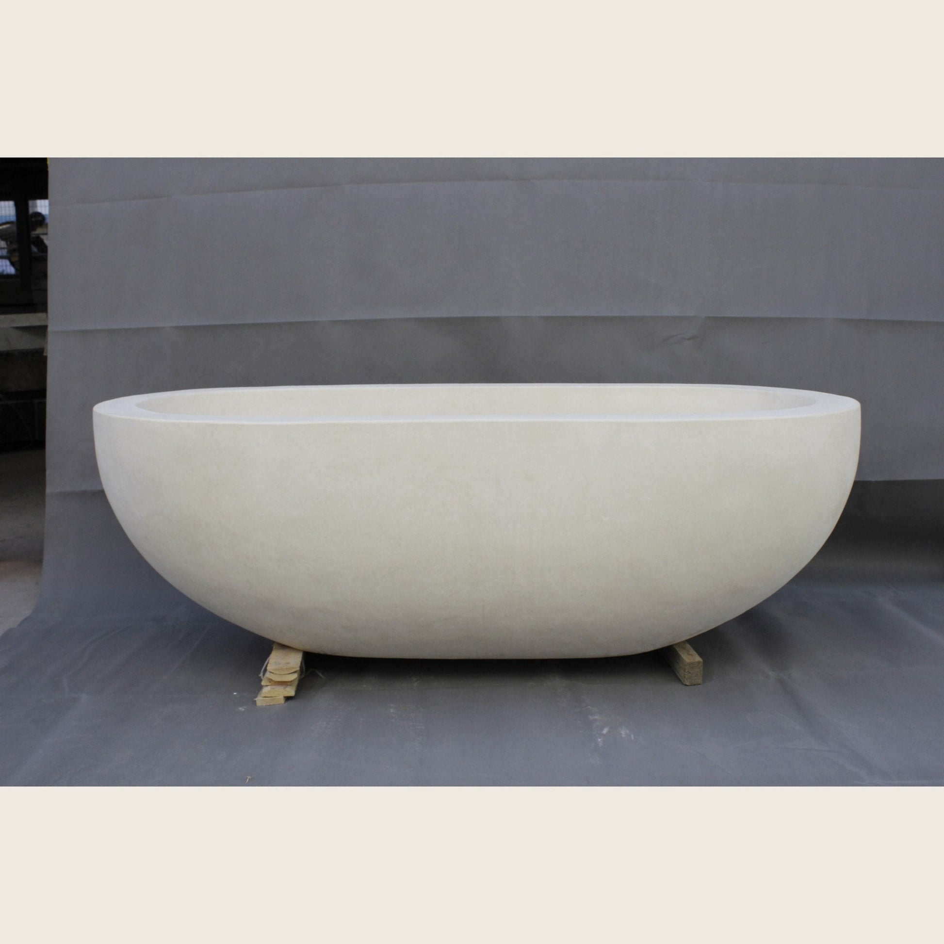 Serena BT-105A Dune Ivory Limestone bathtub, real front workshop view