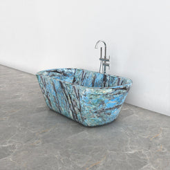 Tivelle Danube Blue Quartzite flared rounded-rectangle bathtub, studio front-view visualization
