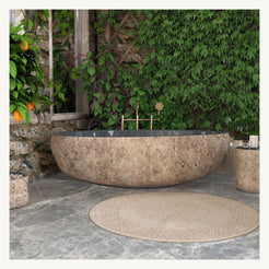 Yitta Filetto Cobble Stone Granite soaking bathtub, centered front view