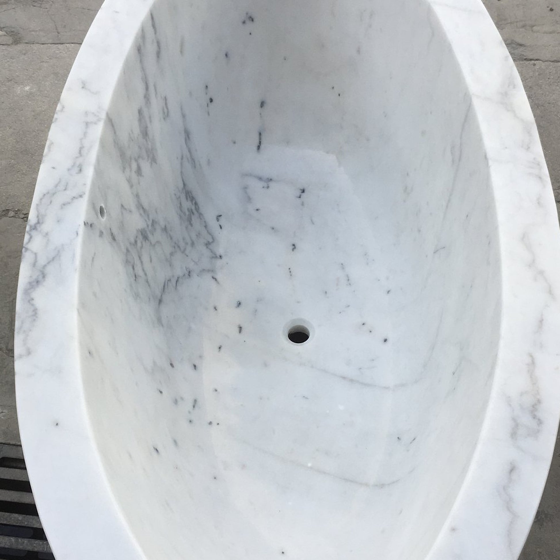 Avela BT-112A Ivory Cloud Marble bathtub, real interior, rim, veining and drain detail