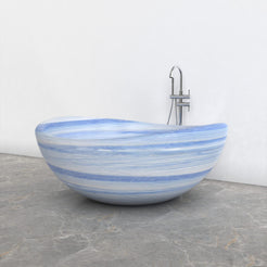 Lunara round freestanding Azura Blue Quartzite soaking bathtub, side view