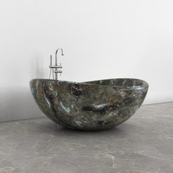 Lunara round freestanding Celestia Blue Quartzite soaking bathtub, side view