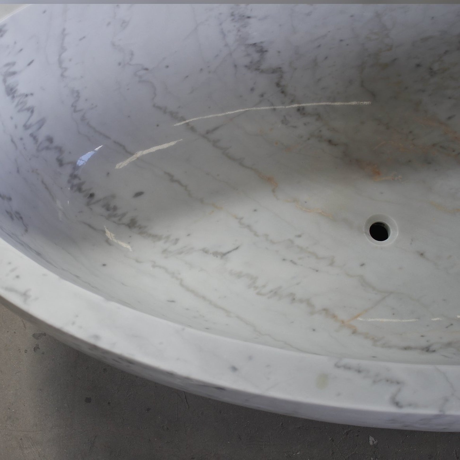 Actual Mira BT-031A Ivory Cloud Marble bathtub, real polished rim, natural veining and drain detail