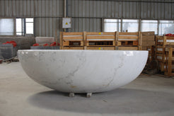 Actual Mira BT-031A solid marble bathtub photographed at the stone workshop, front view