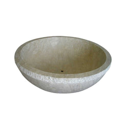 Real interior view of the RHEA Round Travertine bathtub showing the smooth basin and centered drain
