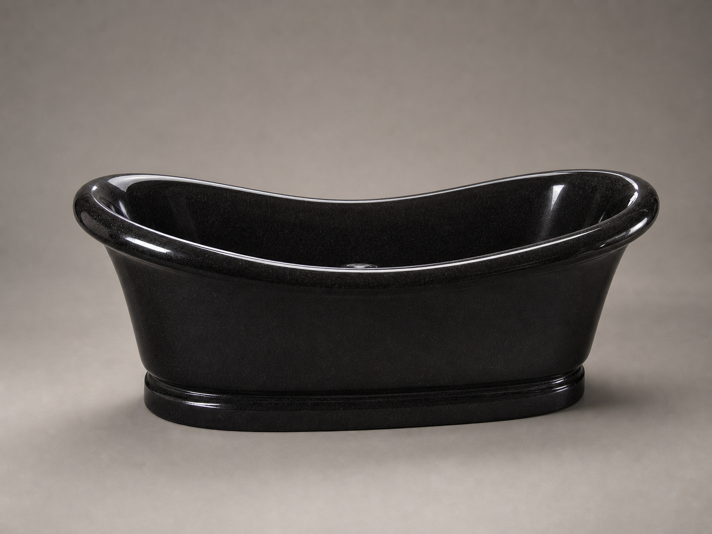 Vallora freestanding Shanxi Black Granite bathtub with flared rim, studio angle