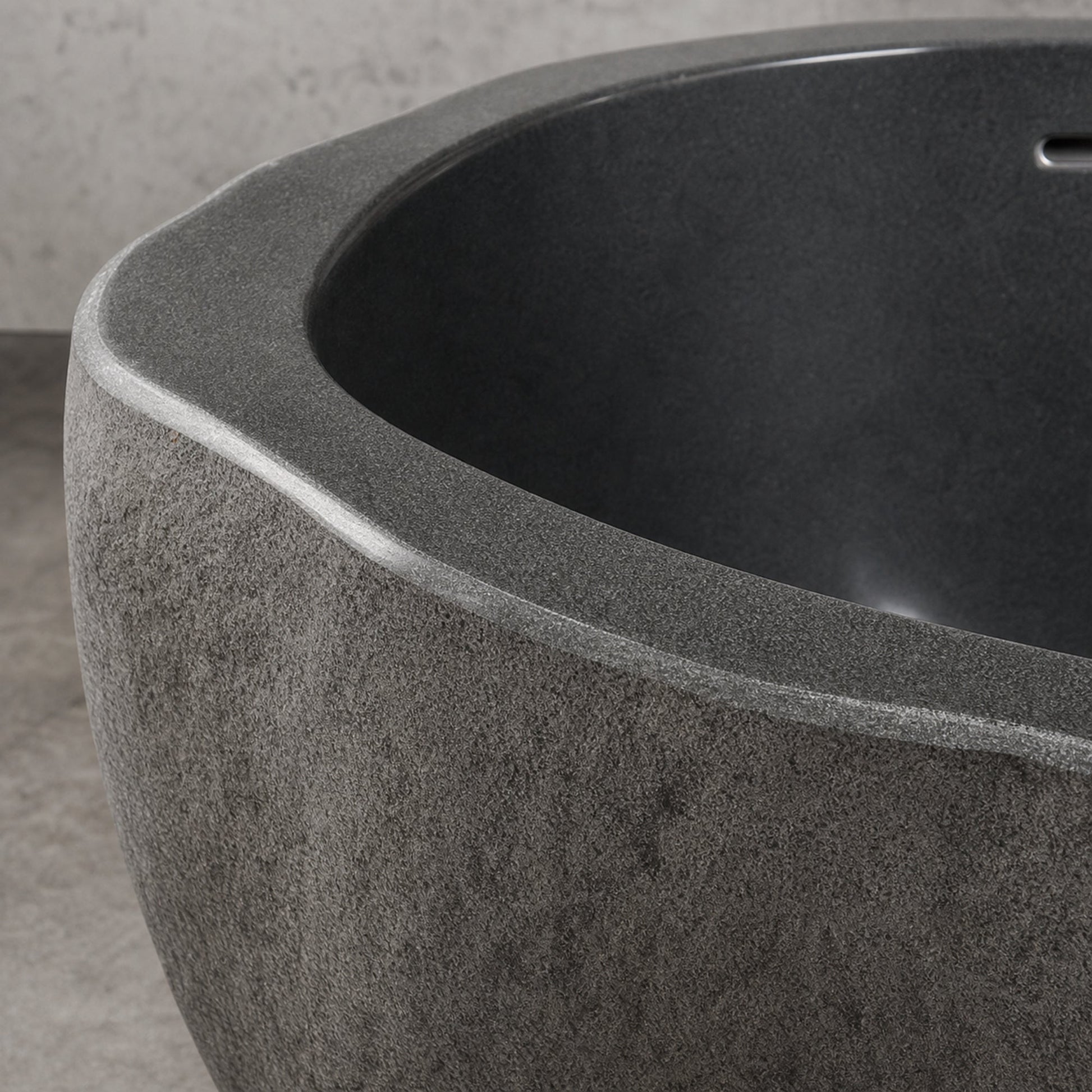 Cavira Charcoal Mist Granite bathtub, natural granite texture and finish detail