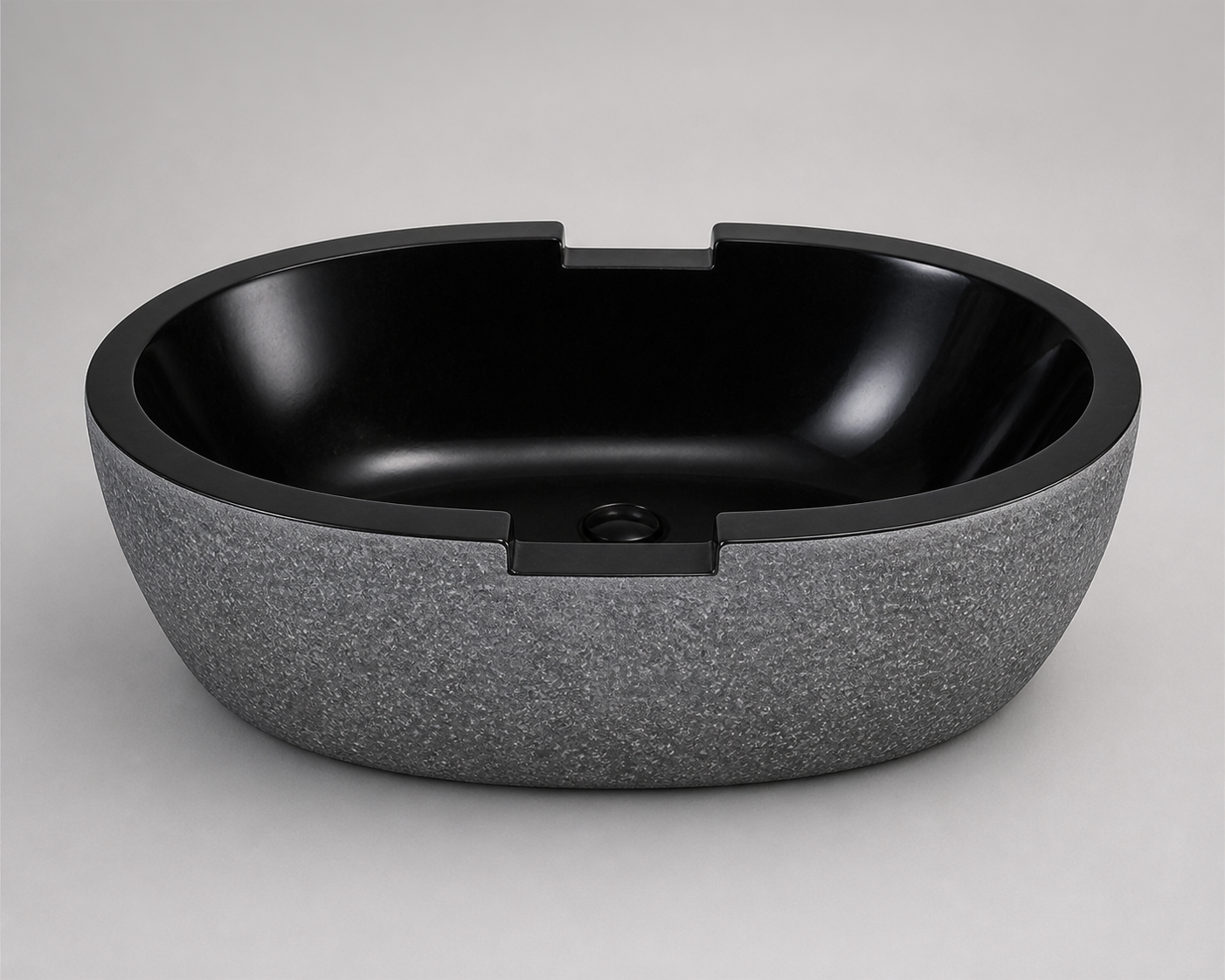 Noctira Absolute Black Granite bathtub with chiseled rim notches, opposite studio visualization