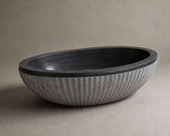 Rivelle fluted black granite soaking bathtub, opposite studio angle
