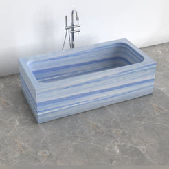 Virelle Azura Blue Quartzite rectangular soaking bathtub, exact-source top and interior view showing rounded-rectangle basin and drain position