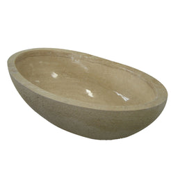 Real three-quarter view of the YARA Beige Travertine freestanding bathtub with chiseled outer texture