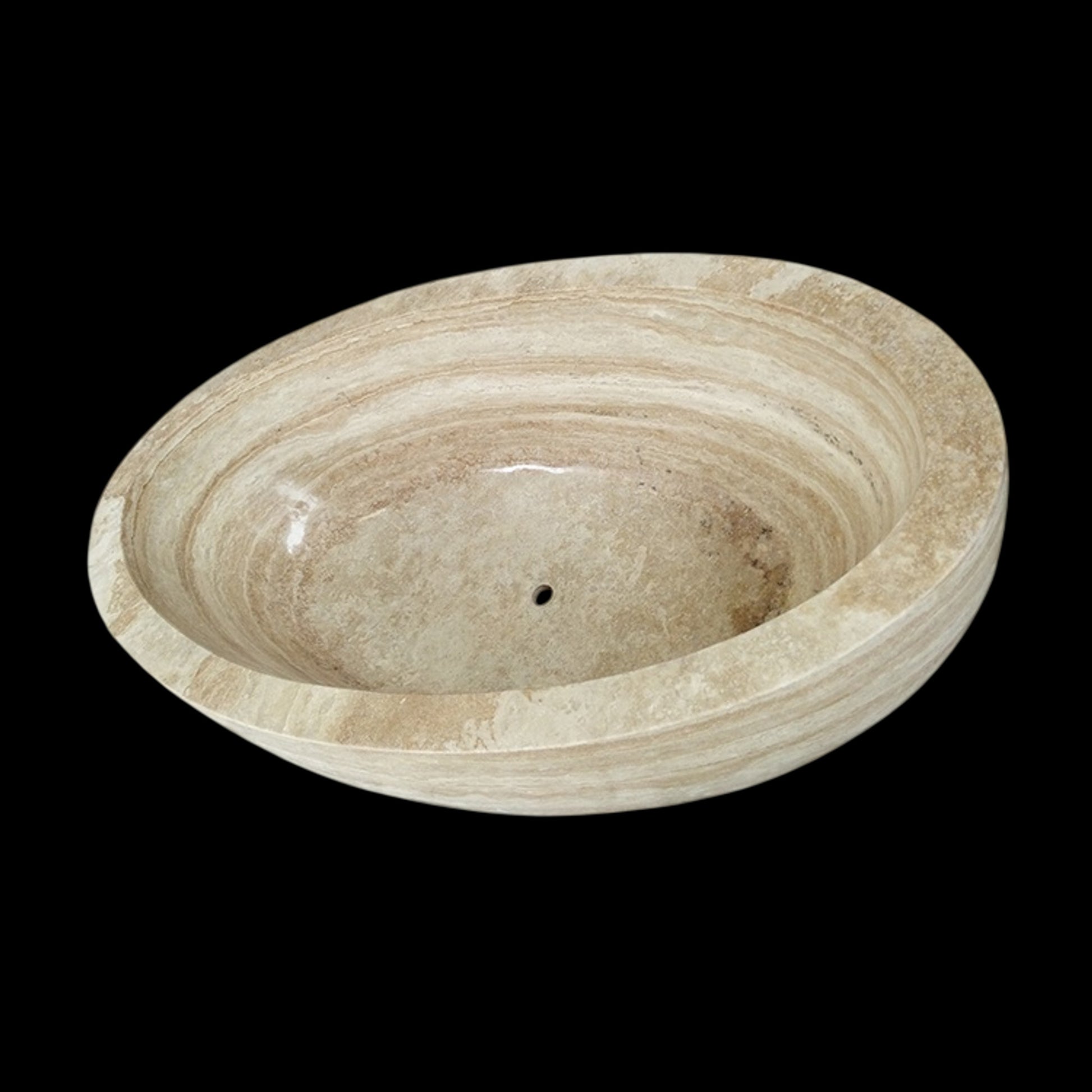 Real interior view of the YOYO Cream Travertine bathtub showing the oval basin and centered drain