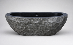 Arden elongated granite bathtub with rugged exterior and polished interior, side profile
