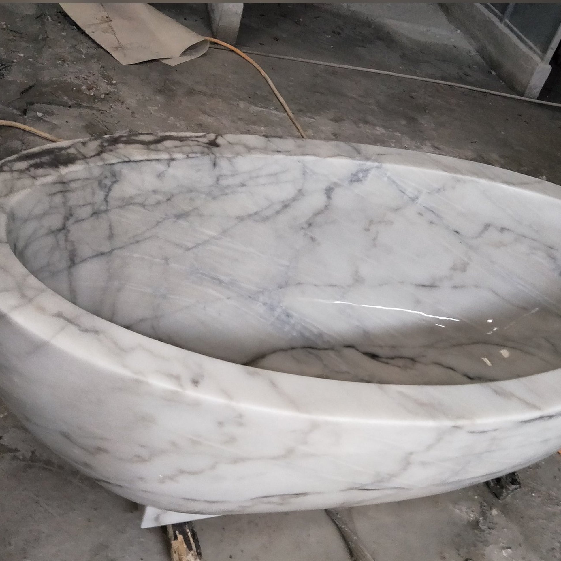 Actual Aurelia BT-038A Ivory Cloud Marble bathtub, polished interior, rounded rim and natural veining detail