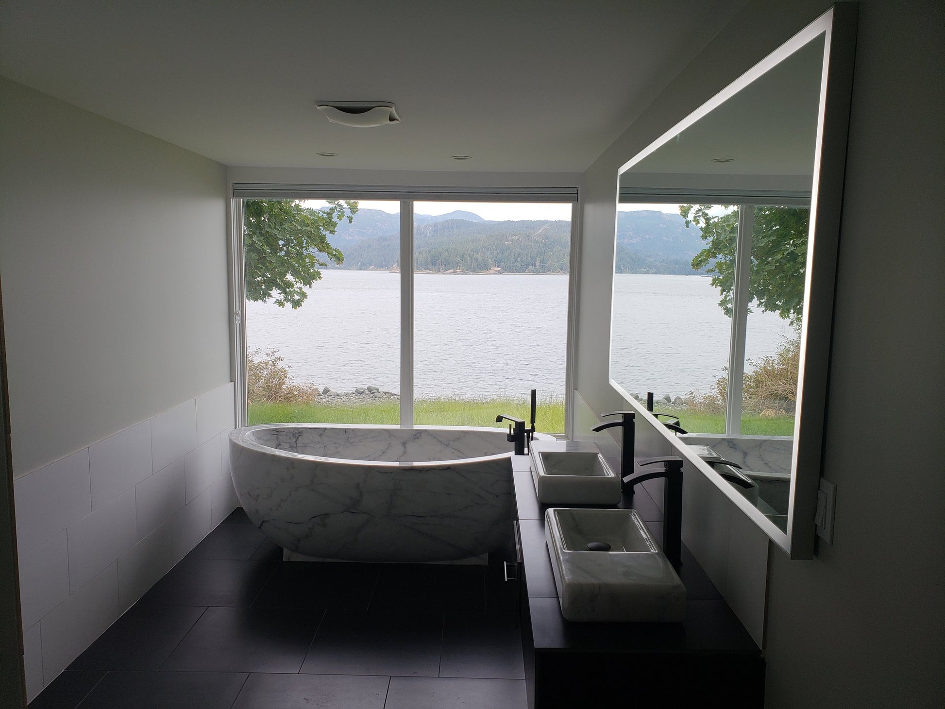 Actual Aurelia BT-038A solid marble bathtub installed in a residential bathroom
