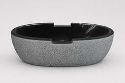 Noctira Absolute Black Granite bathtub, textured exterior side-profile studio visualization