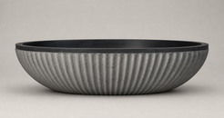 Rivelle Natural Black Granite bathtub with vertical ribbed exterior, side profile