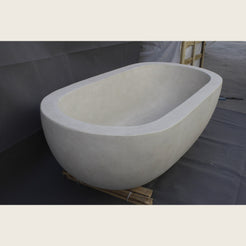 Serena Dune Ivory Limestone bathtub, real honed stone and rounded rim detail