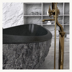 Yura boat-shaped Neroco Granite bathtub, natural granite texture and finish detail