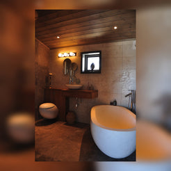 Elara freestanding White Limestone bathtub in a real residential bathroom project