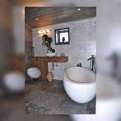Elara freestanding White Limestone bathtub in a real residential bathroom project
