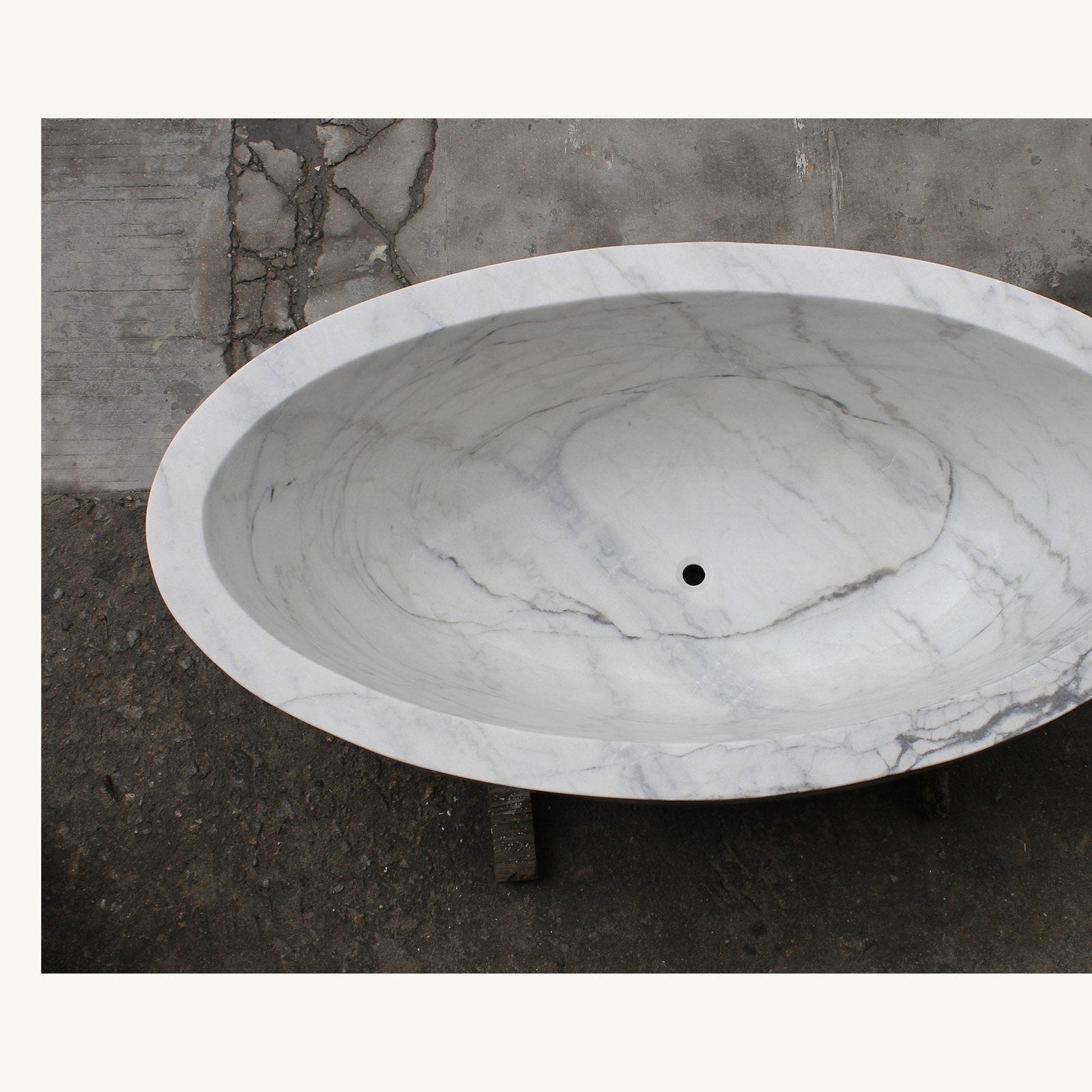 Celeste Ivory Cloud Marble soaking bathtub, real top view showing deep oval interior