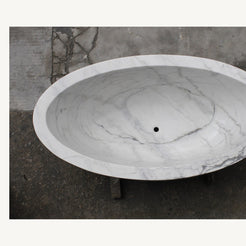 Celeste Ivory Cloud Marble soaking bathtub, real top view showing deep oval interior