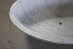 Mira Ivory Cloud Marble bathtub polished interior, natural veining, and drain detail